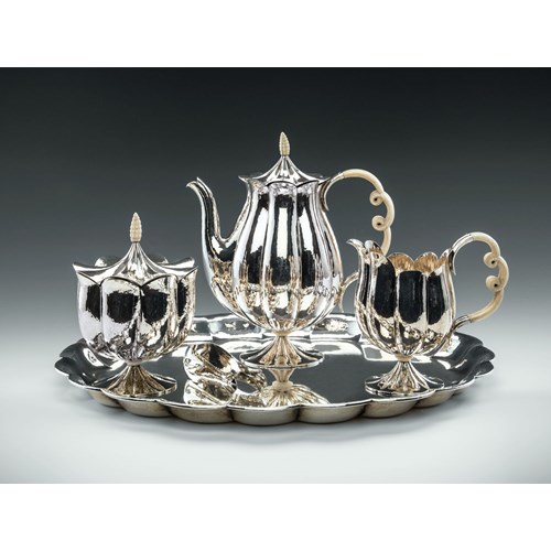 MUSEUM-QUALITY SILVER TEA SET
consisting of: teapot, creamer, covered sugar bowl, sugar tong, tray

